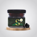 Pure Himalayan Shilajit jar on wooden platform